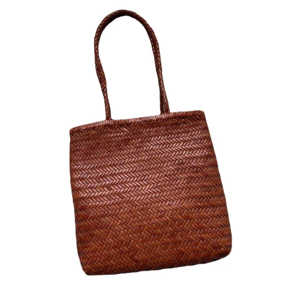 Brown woven leather tote bag with three-dimensional pocket and shoulder strap