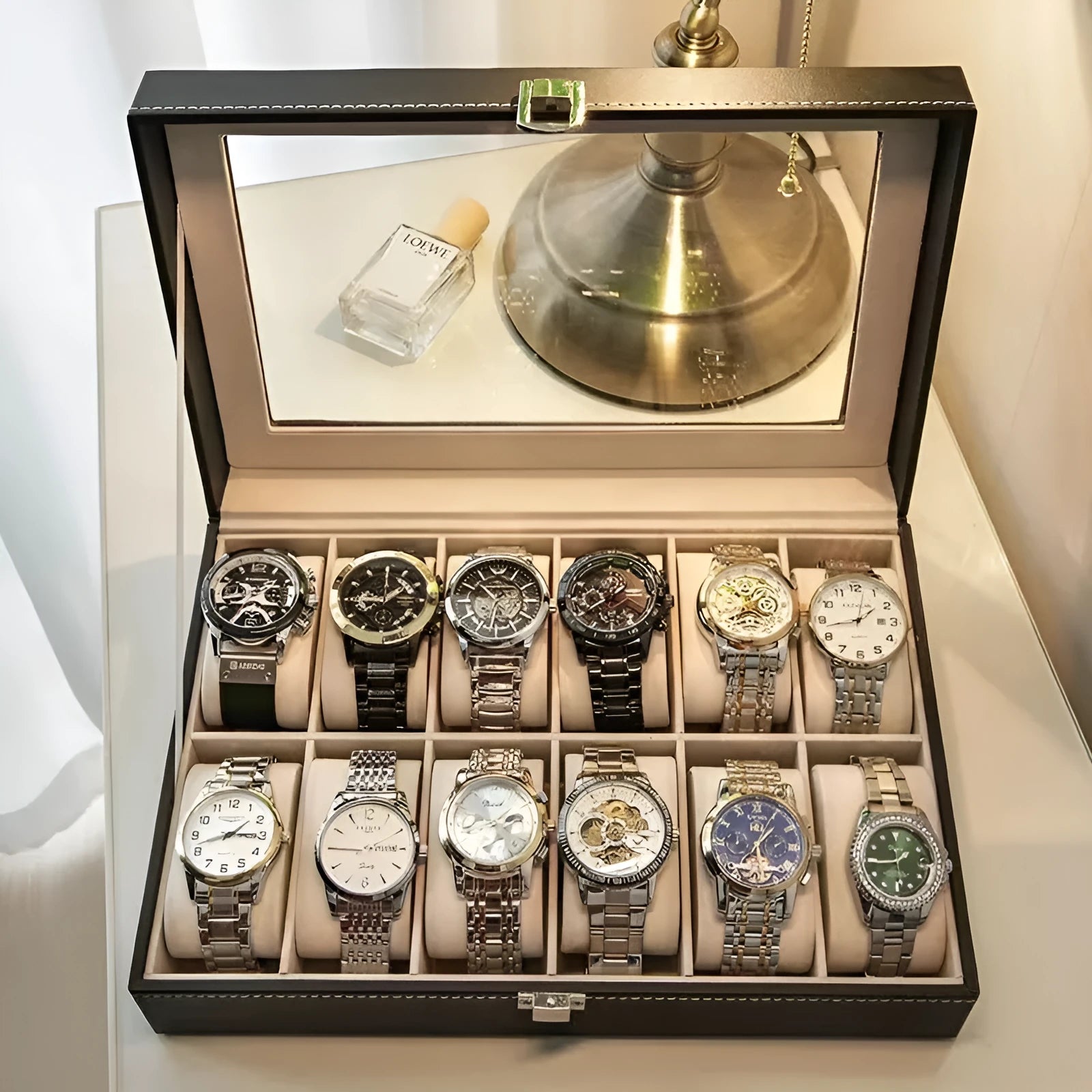 Grey leather watch storage box with transparent dustproof lid showing multiple watch slots inside