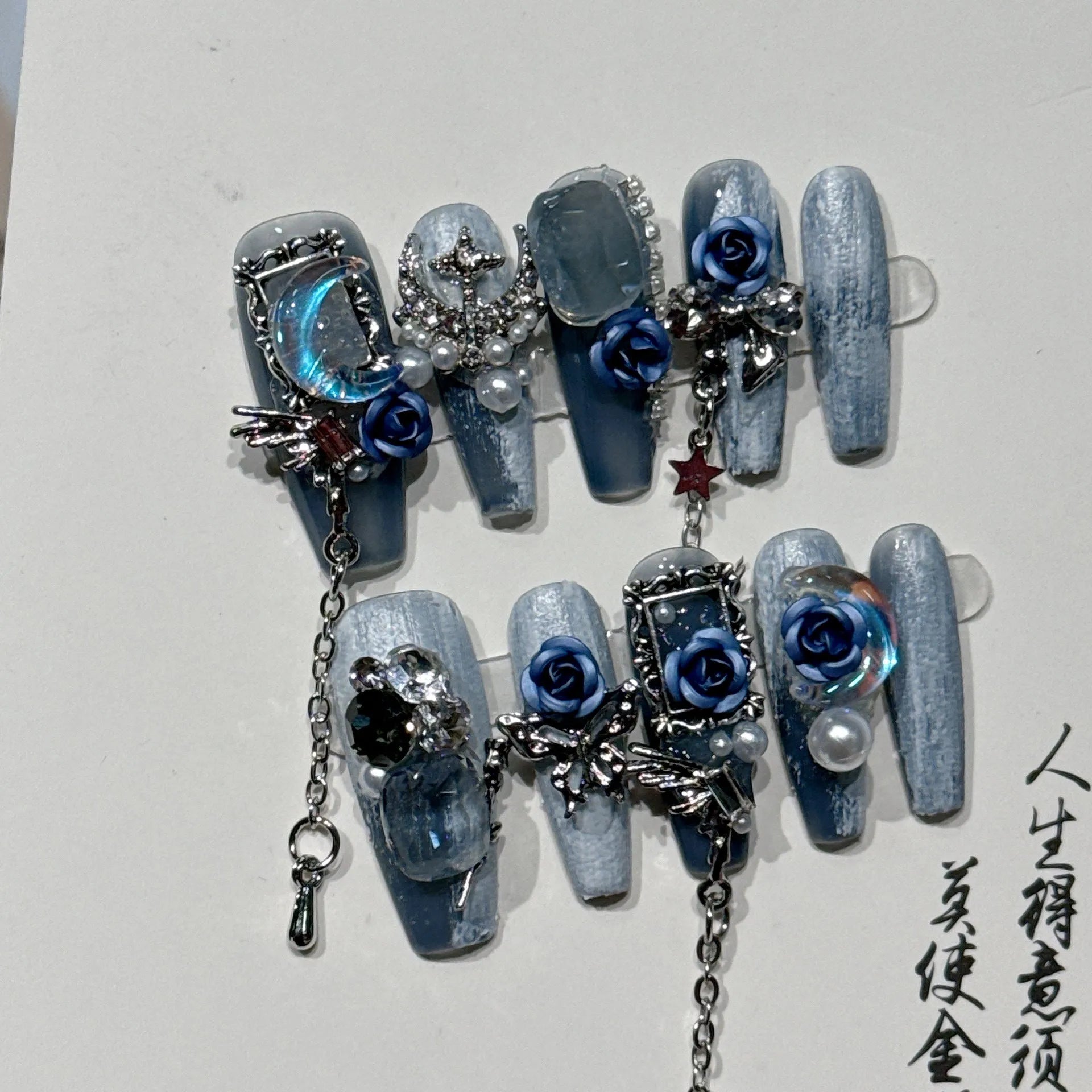 Heavy industry night blue false nails with rose and floral patterns in plastic armour suit
