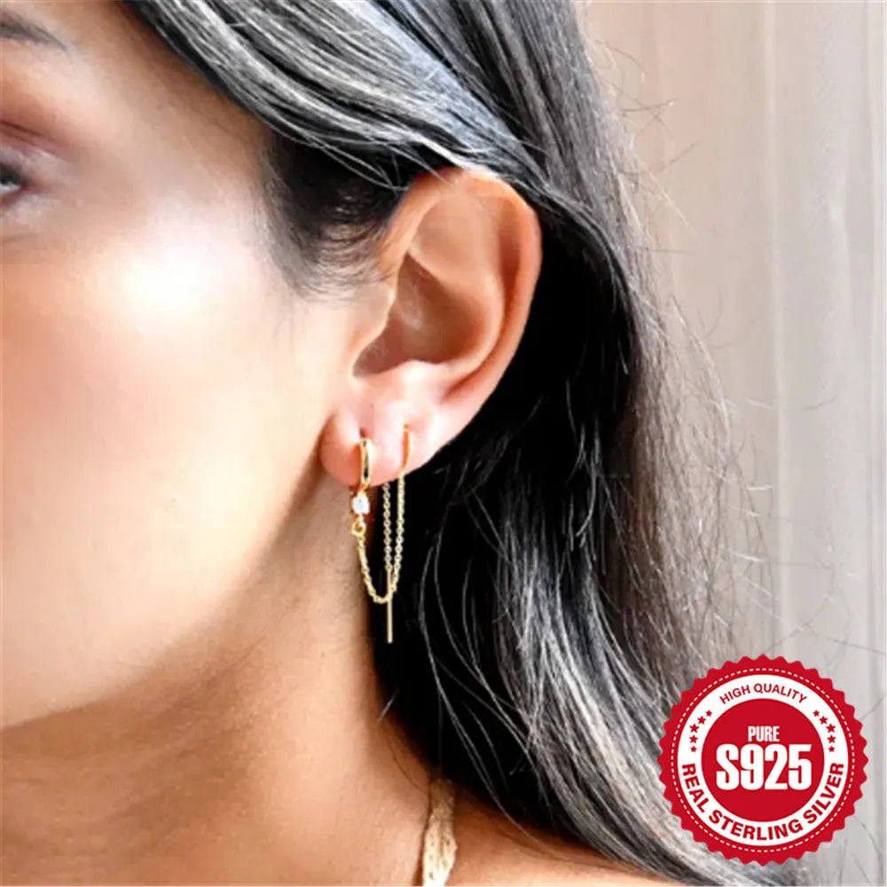 S925 sterling silver geometric stud earrings with gold electroplated flower, tassel, and chain design.