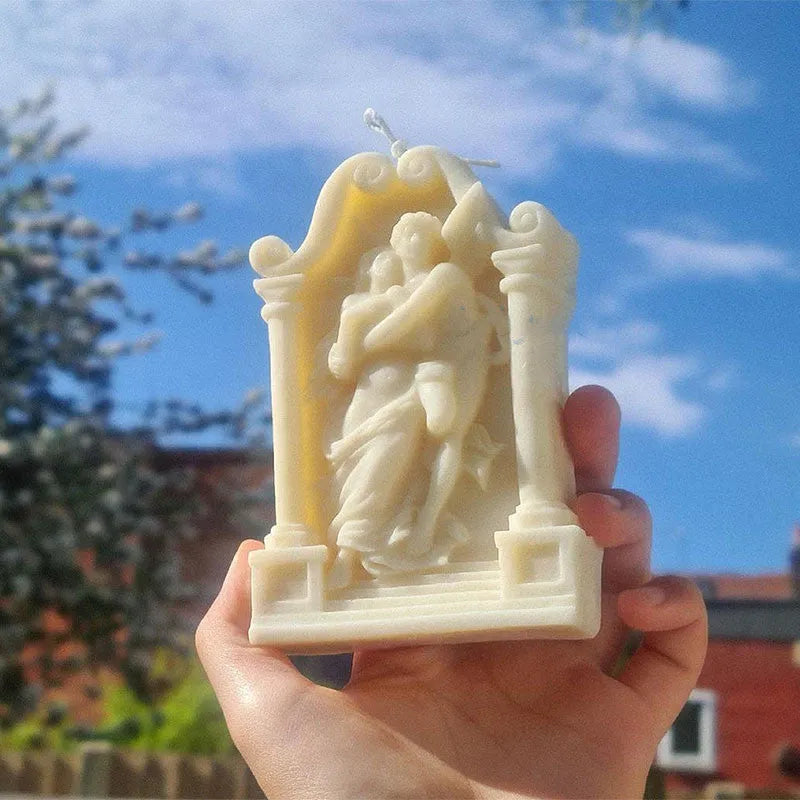 Food-grade silicone mould showing detailed Ancient Greek couple angel design for baking and crafts.