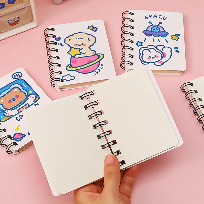 Astronaut flipped portable pocket flipper notebook showing space-themed cover designs at 10.5cm by 8cm