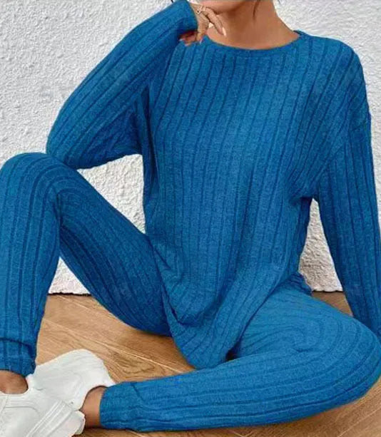 Women's black sunken stripe casual two-piece homewear set with short sleeve top and trousers.