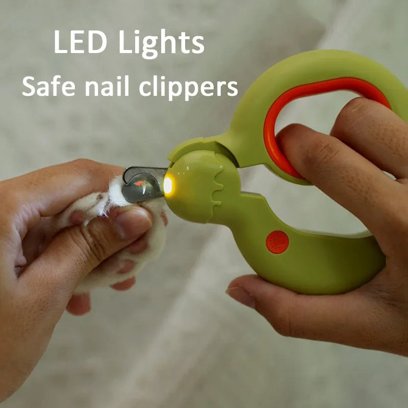 Blue pet nail clippers with LED light on, showing stainless steel blade and ergonomic handles for cat and dog grooming