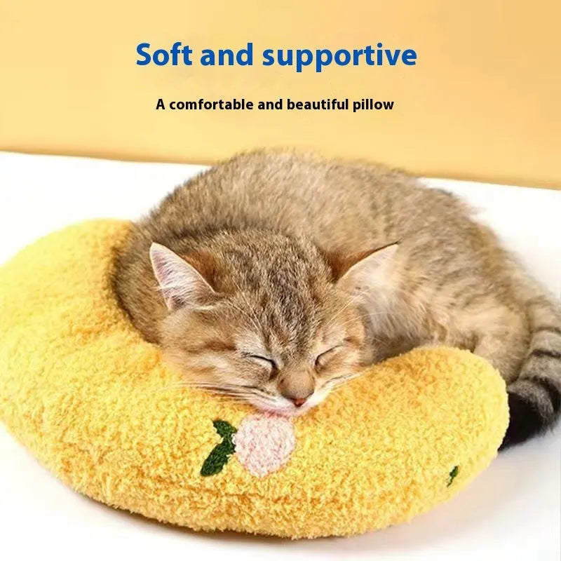 Blue cloth cat sleeping mat with a large U-shaped question mark pillow for neck support.