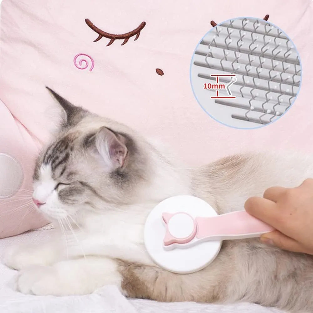 Blue self-cleaning cat grooming brush with rubber-tipped metal pins and ergonomic rubber handle