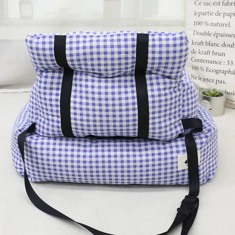 Grey and blue plaid cloth dog car travel nest shown on a car seat, with small and large size options.
