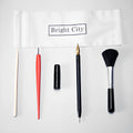 Scraping painting tools set with multiple art tools on white card surface