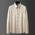 Coffee coloured striped men's long-sleeved shirt with a slim fit on a hanger.