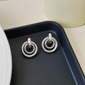 Geometric round ring earrings with irregular design in gold and silver electroplated finishes