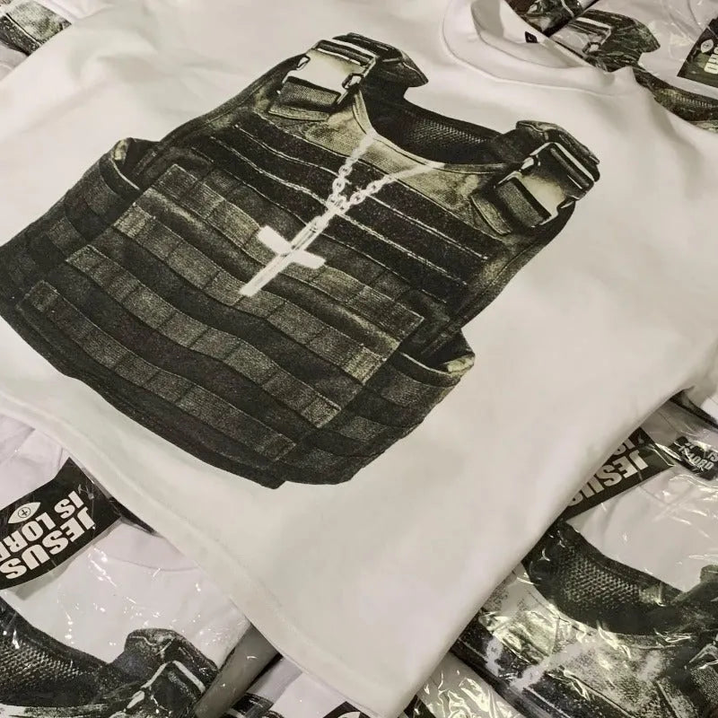 A person wearing a printed cotton short sleeve T-shirt with retro graphics and drop shoulder sleeves in a contrast colour.