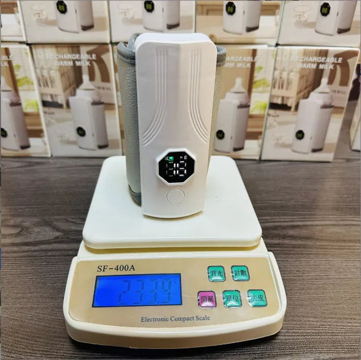 Grey and white car charger electric milk warmer for baby bottles with 12V plug.