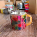 American style resin coffee cup with painted book mark design measuring 13x10x10cm