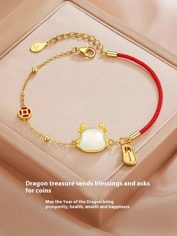 Women's silver-plated bracelet with Dragon zodiac motif and central Hetian jade stone.