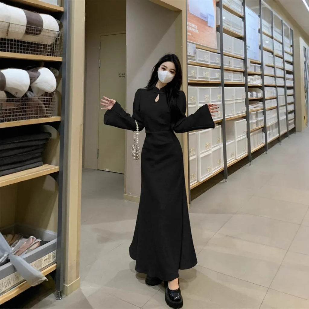 Plus size cheongsam dress in black with waist-tight draping, long sleeves, and long skirt