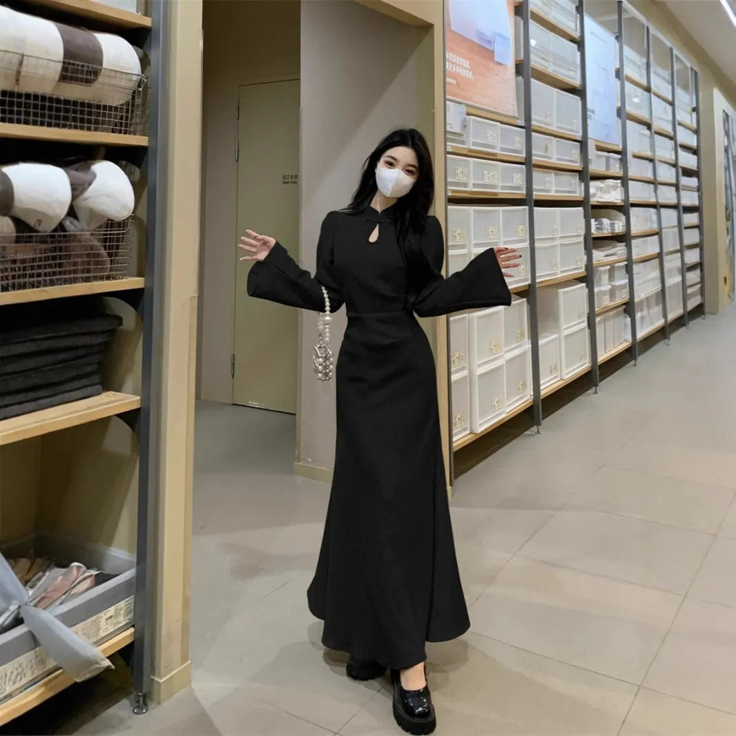 Plus size cheongsam dress in black with waist-tight draping, long sleeves, and long skirt
