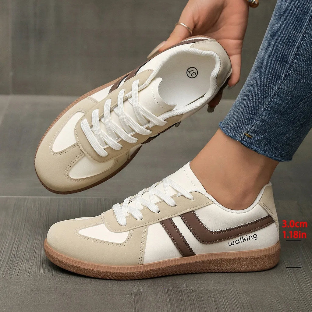 Women's retro casual sneaker in a wine red colour with a round toe, flat rubber sole, and front lace-up fastening.