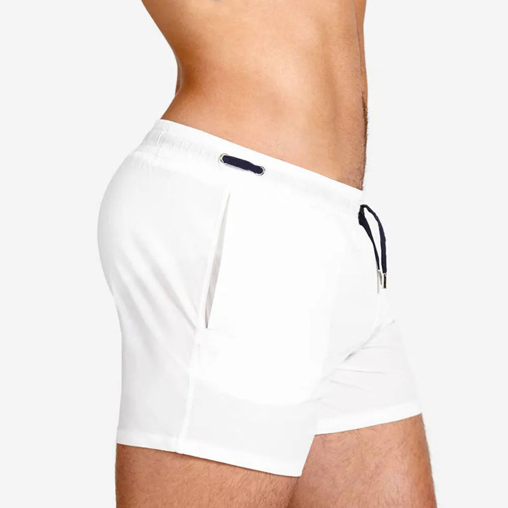 Men's solid colour swimming shorts with mesh lining in army green, shown on a white background.
