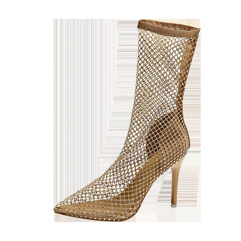 Gold high heel sandals with mesh upper and pointed stiletto design on rubber sole