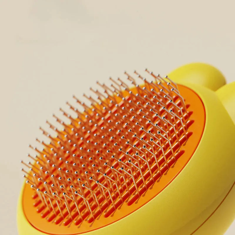 Green self-cleaning pet brush with release button and stainless steel comb for grooming cats and dogs