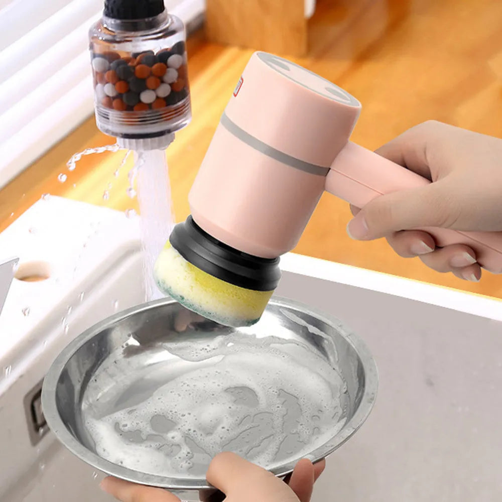Green rechargeable electric cleaning brush with three interchangeable scrub heads on a kitchen counter.