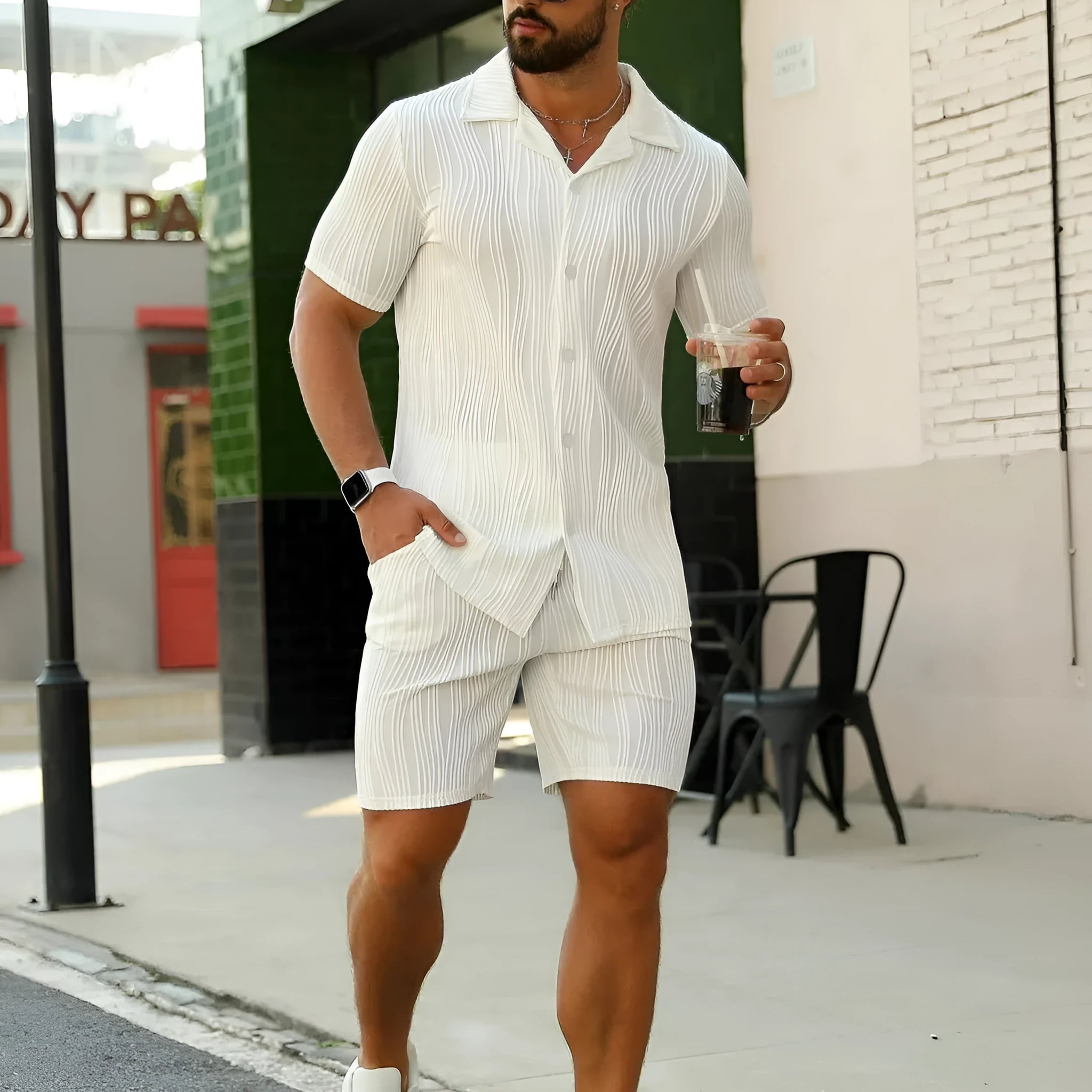 Men's casual summer suit with wave pattern design showing short-sleeved top and matching shorts