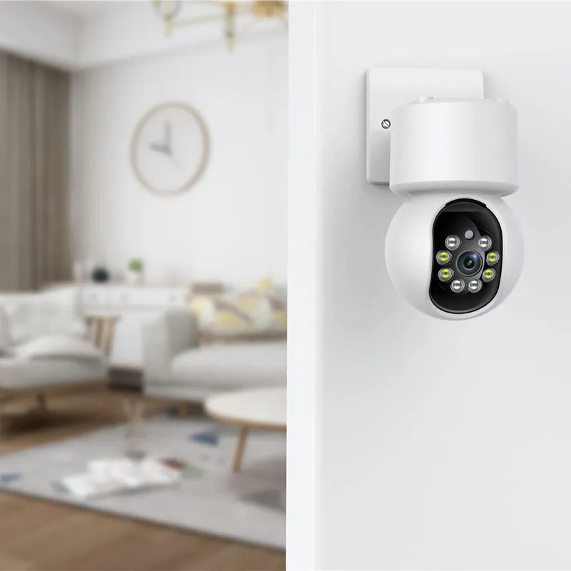 White indoor Wi-Fi smart security camera on a stand with 360-degree rotation for panoramic monitoring.
