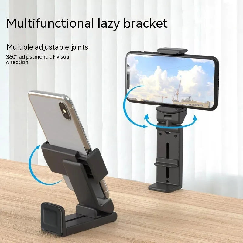 Black 360-degree rotating collapsible phone holder on desktop showing adjustable viewing angles