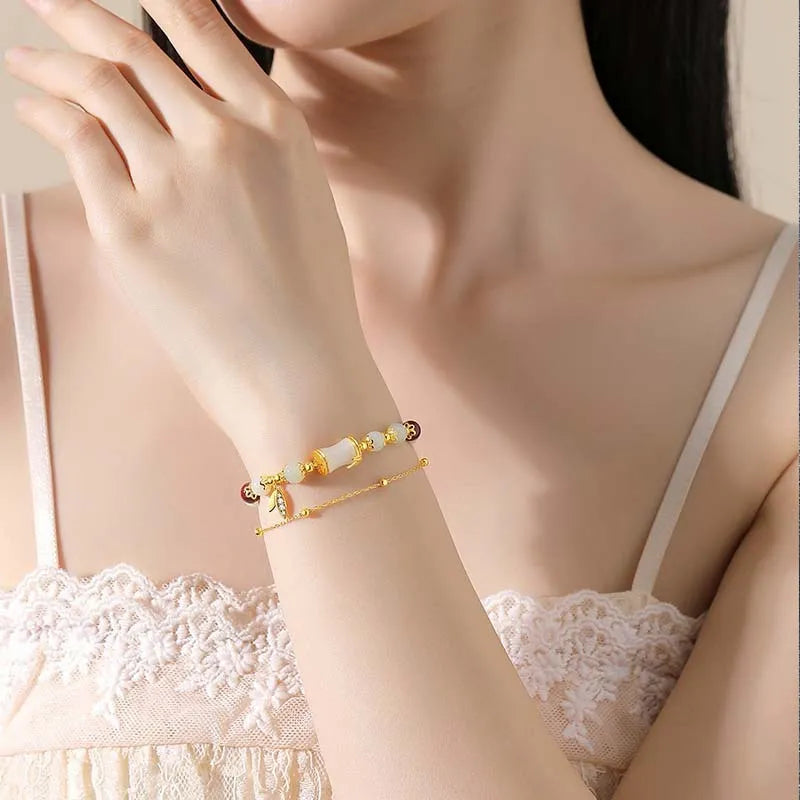 Retro style Ruyi floral bracelet made from coloured glaze and glass in beige, green, light green, or white.