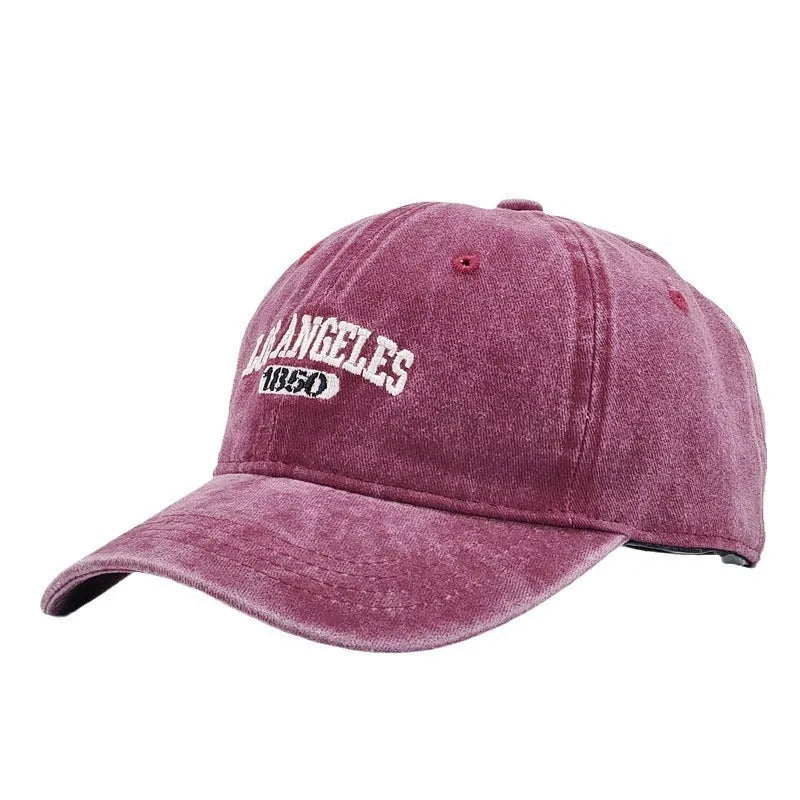 Retro personalised peaked cap with embroidered letters on washed distressed fabric