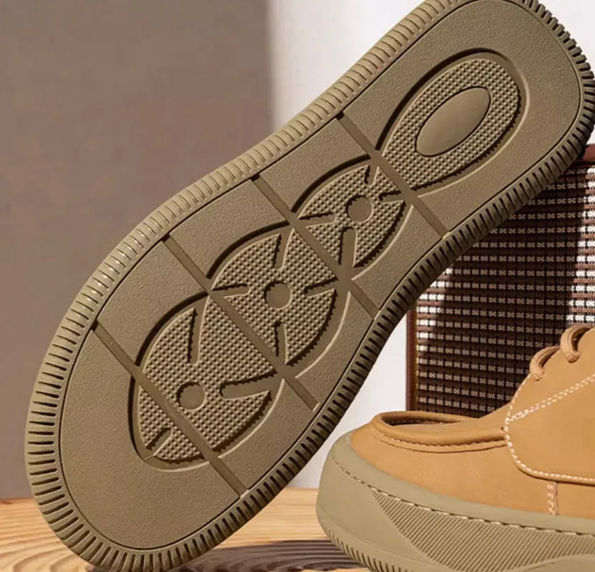 Brown retro-style casual leather shoes with big toe design on a neutral background