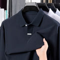 Men's loose fit cotton polo shirt with lapel collar in grey, shown on a hanger.