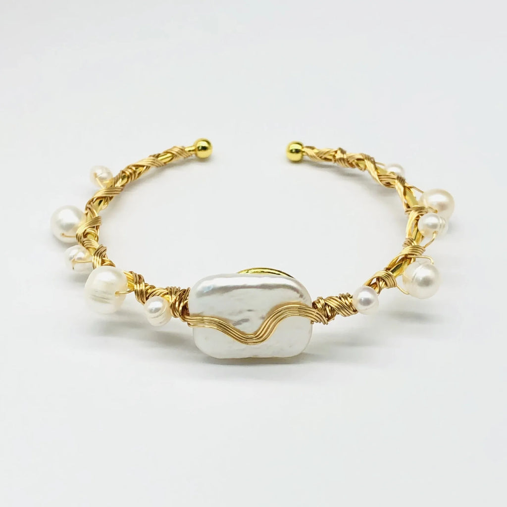 Natural freshwater pearl handmade wire-wrapped bracelet in gold titanium steel on wrist