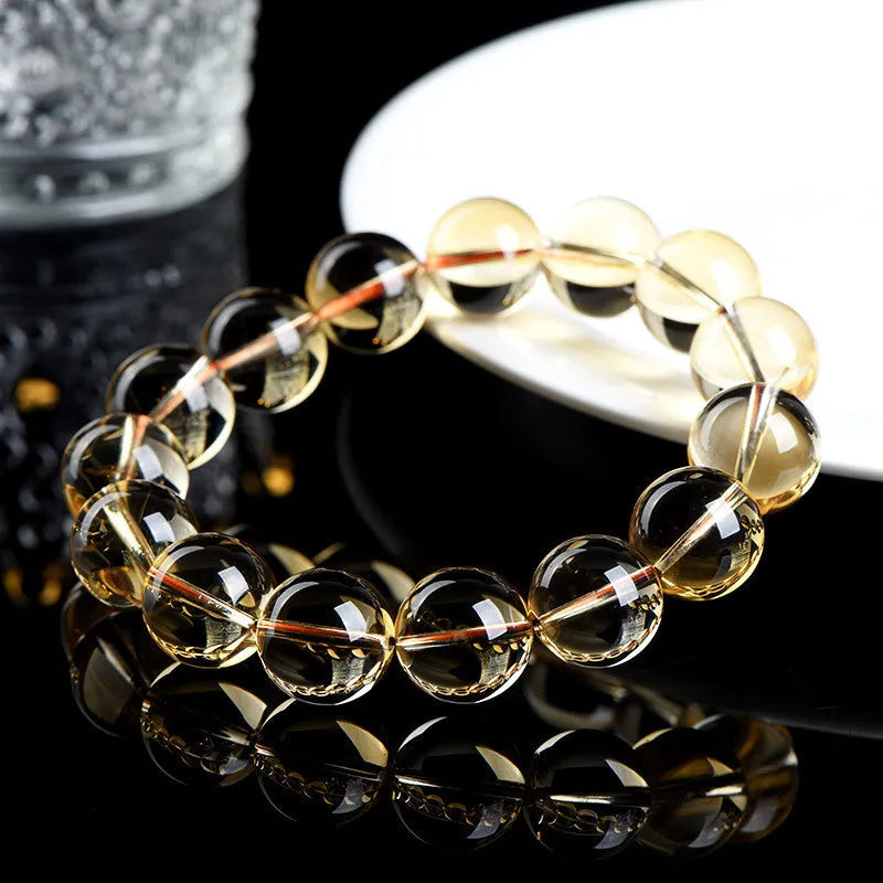 Natural citrine scattered beads ball bracelet on a wrist, showing polished stones in a choice of colours and sizes.