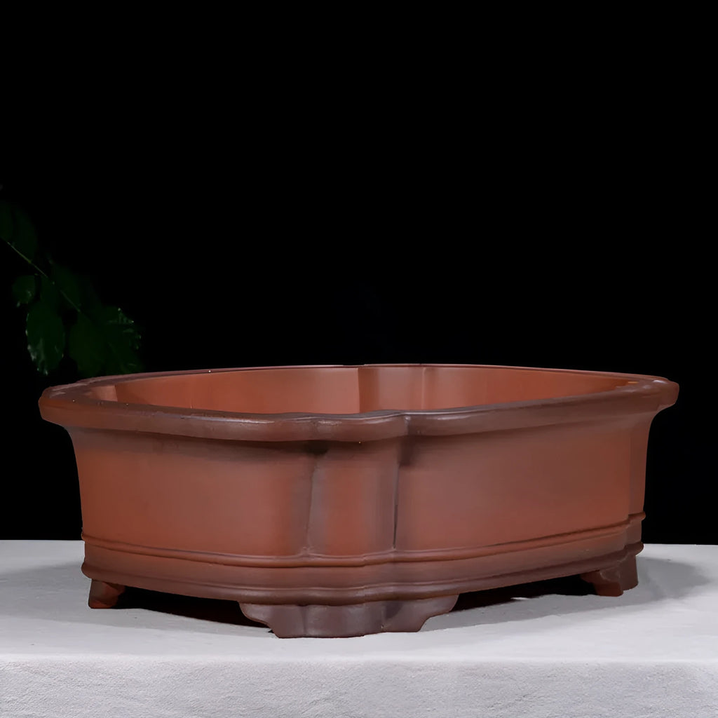 Large antique finish purple clay flower pot with Chinese tree stump design showing pine cypress pomegranate motifs