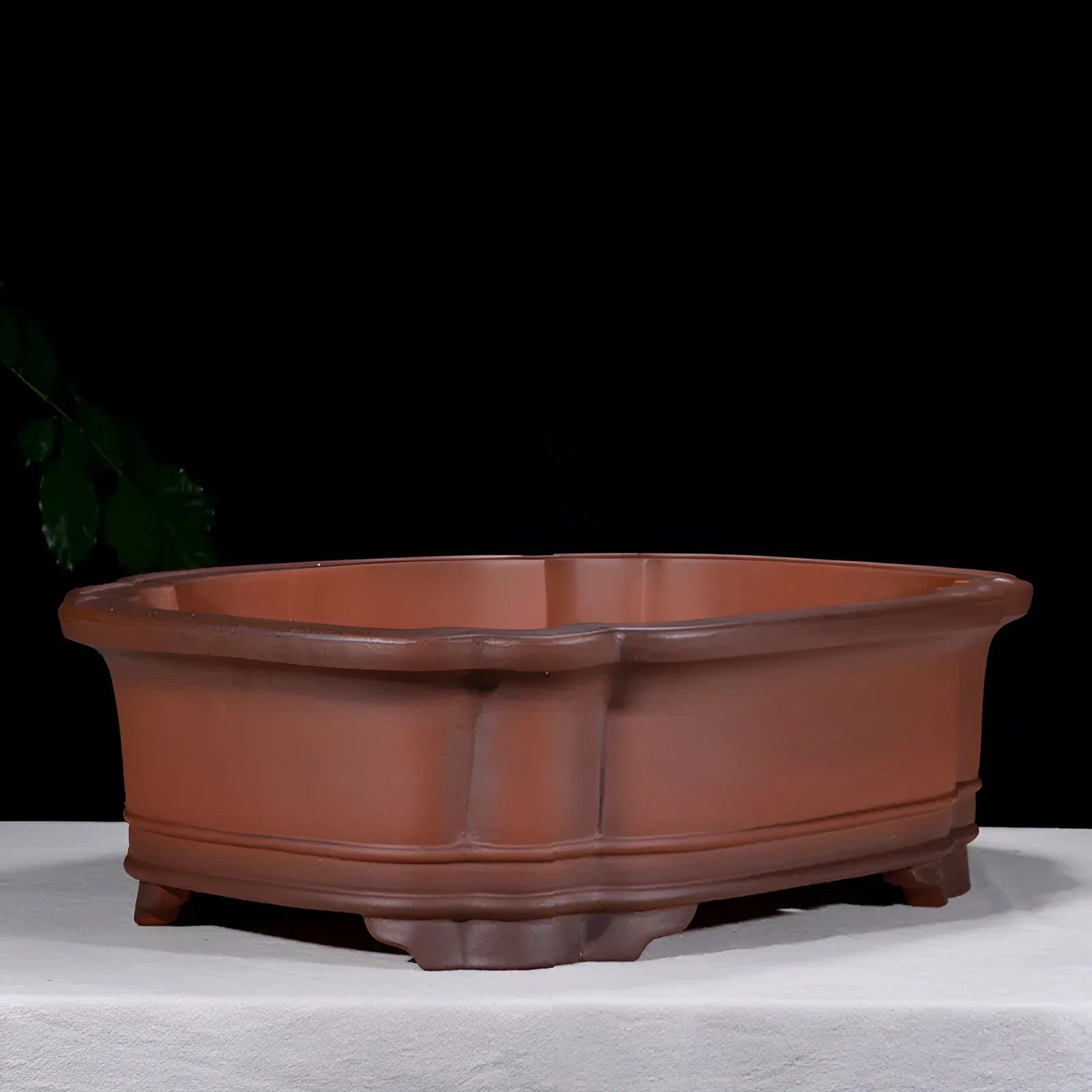 Large antique finish purple clay flower pot with Chinese tree stump design showing pine cypress pomegranate motifs