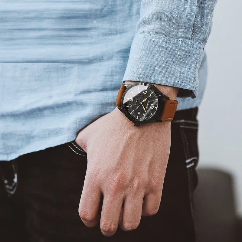 Men's retro automatic watch with leather strap on wrist