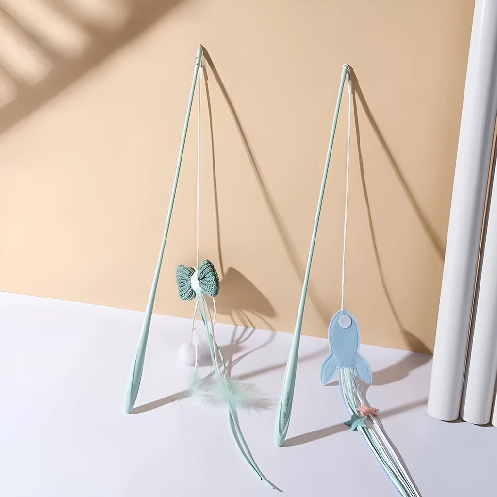Blue cat teaser toy on a long pole with white feathers and an inflated ego component.