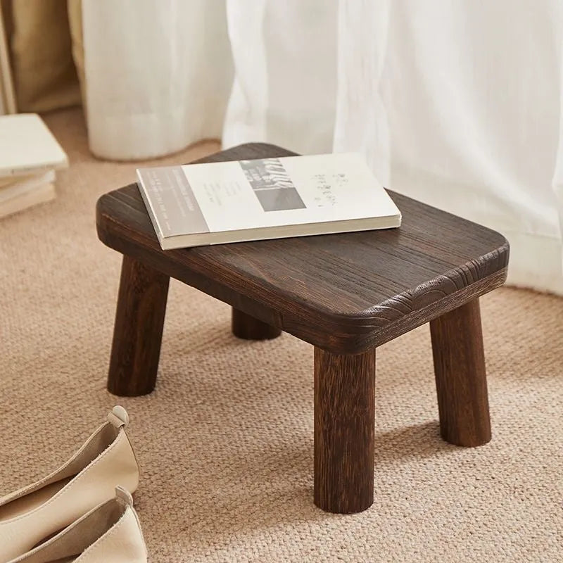 Distressed solid wood changing stool with bracket structure for shoe changing.