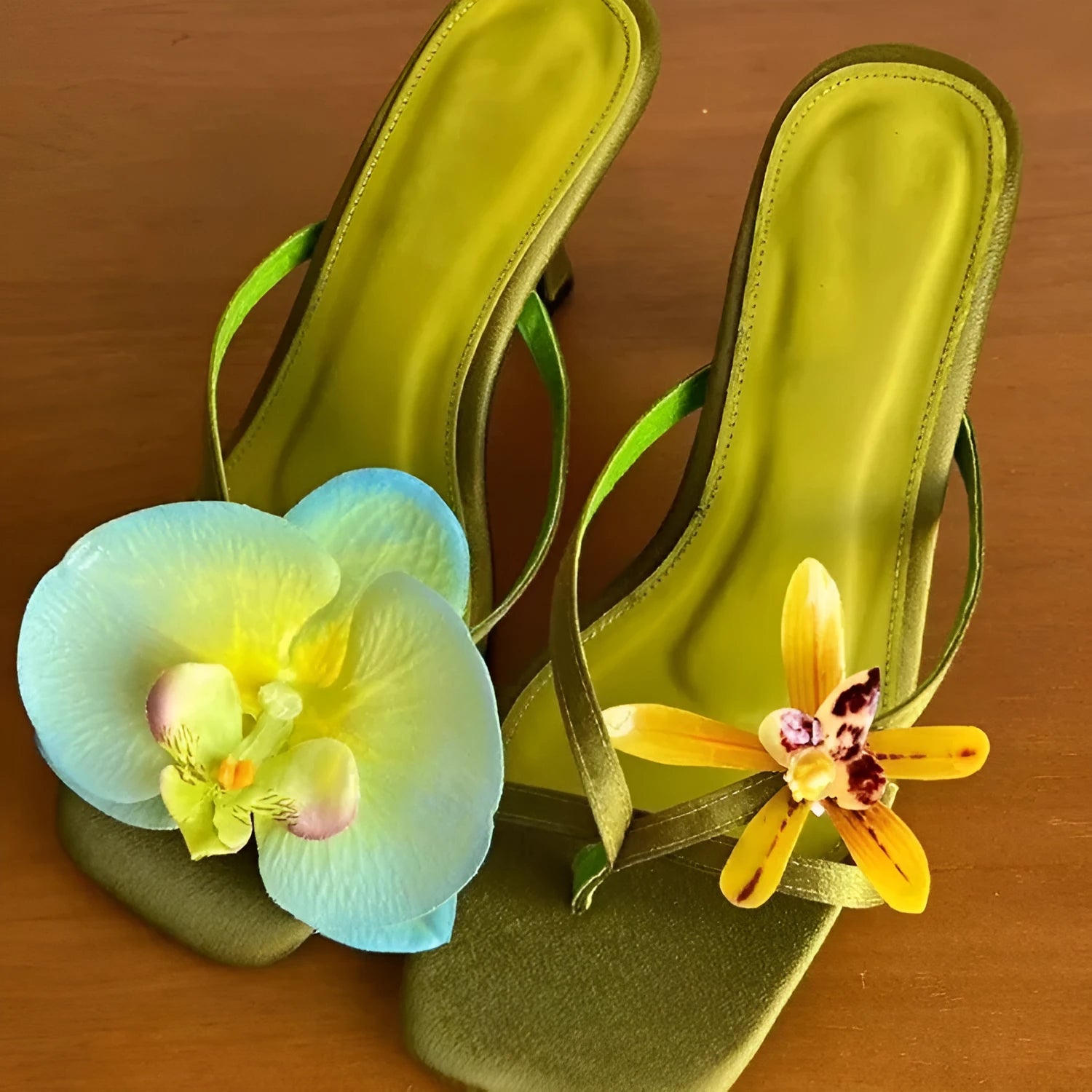 Women's handmade asymmetric floral high heel sandal in calf leather on a white background.