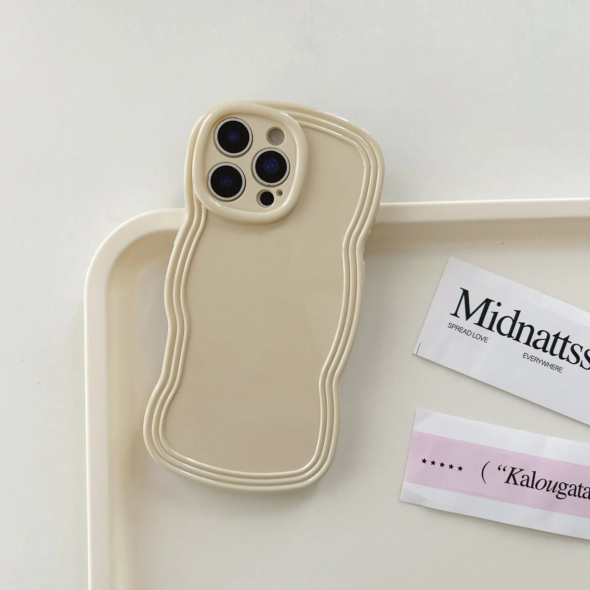 Cream candy colour wave design TPU case for iPhone on a white background.