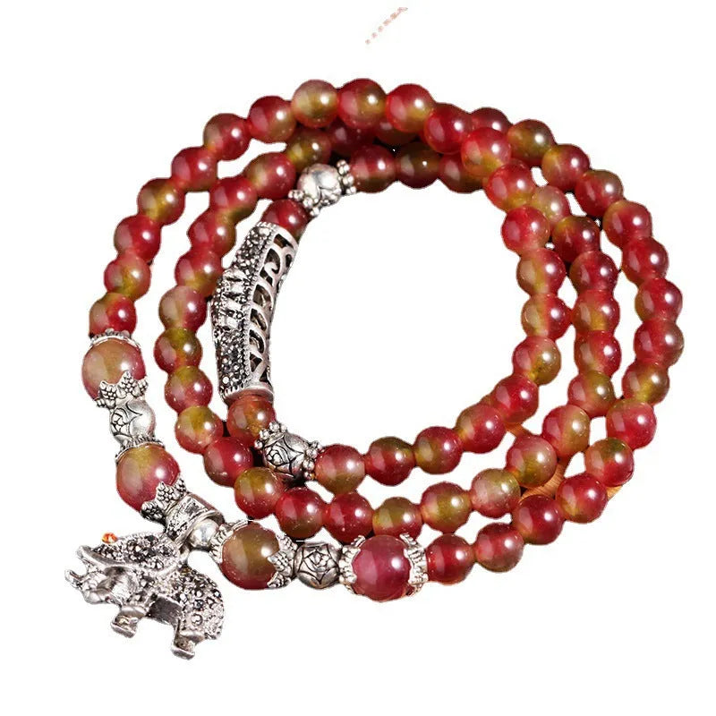 Handmade natural watermelon crystal bracelet with Chinese knot fastening and geometric beads