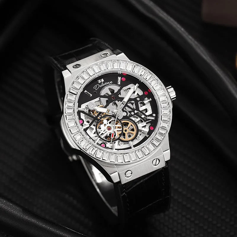Automatic diamond studded skeleton men's watch with white shell case and blue dial on leather strap.