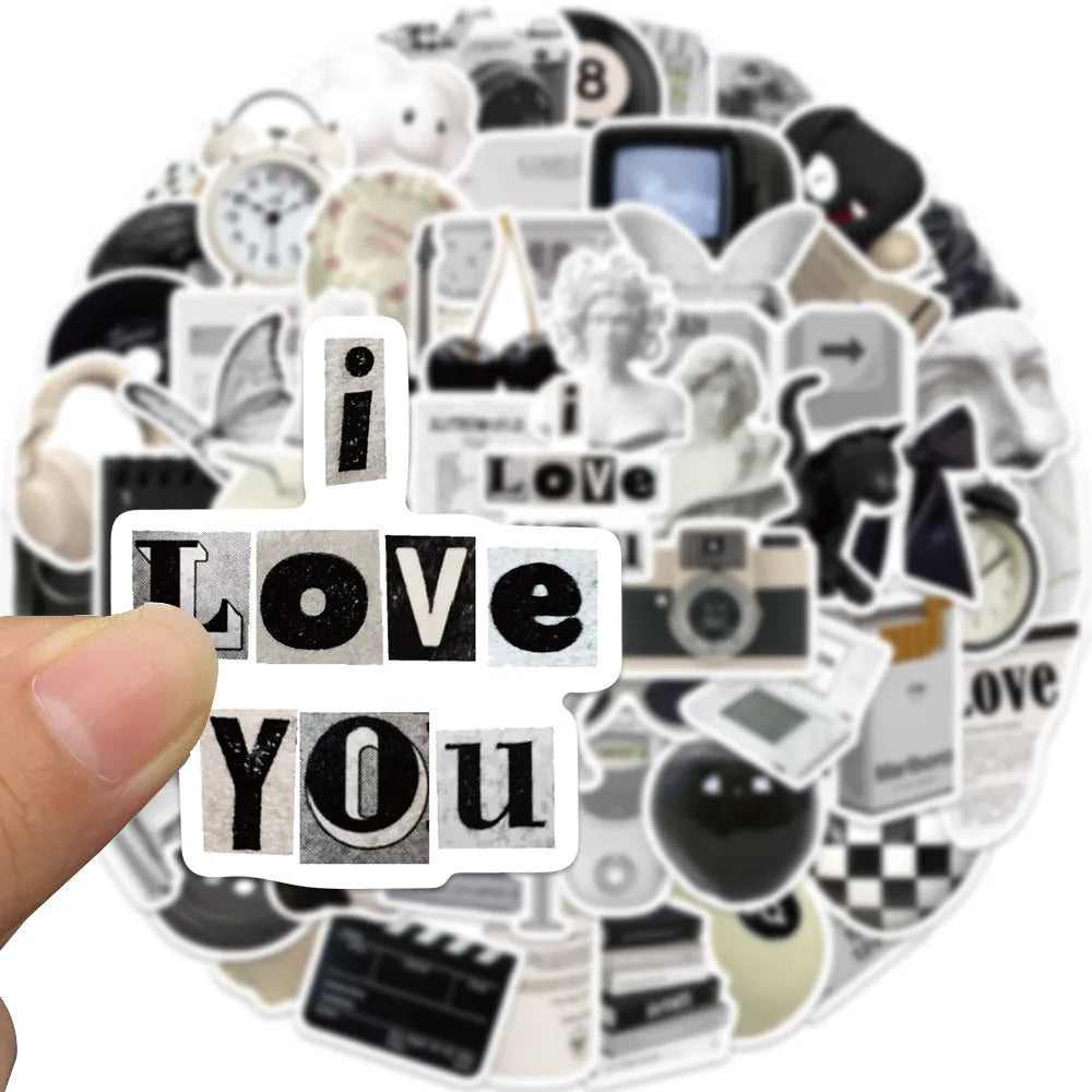 Assortment of black and white vinyl stickers featuring coffee cups and abstract designs for laptops and phones.