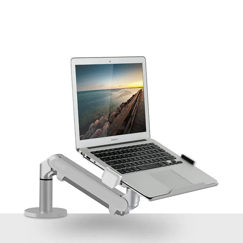 Silver aluminium alloy computer stand with hover bracket design supporting a laptop