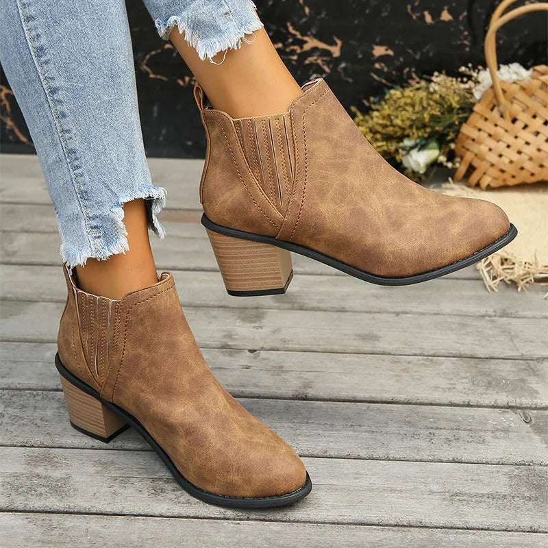 Women's black pointed toe ankle boots with thick square heel slip-on design
