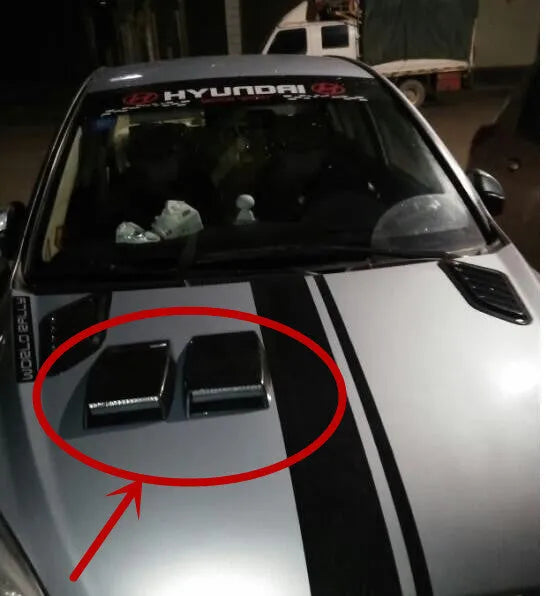 Black, white, and silver ABS plastic car decoration simulation air vent with tapered design.