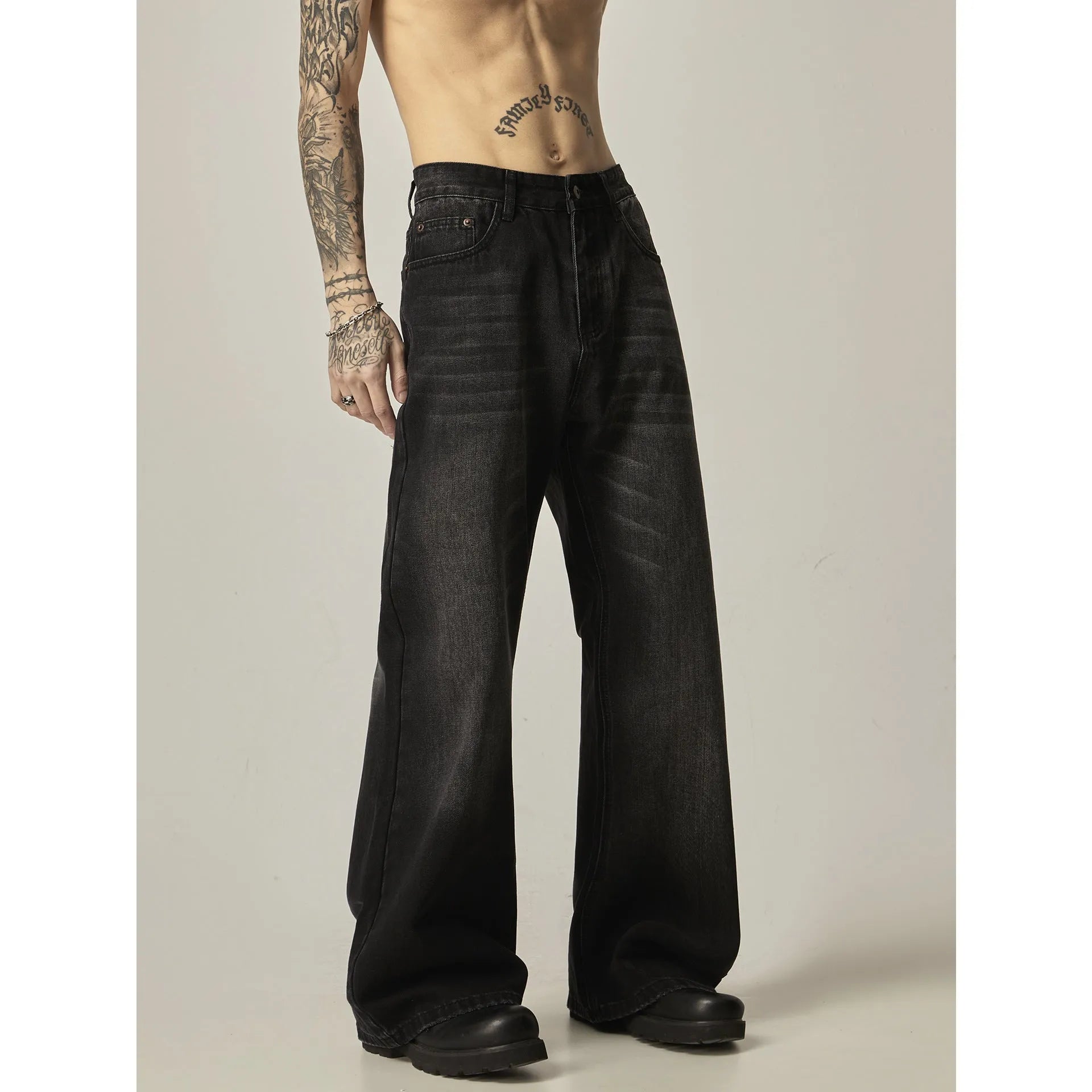 Black loose straight leg jeans with American retro styling and zipper fly front.