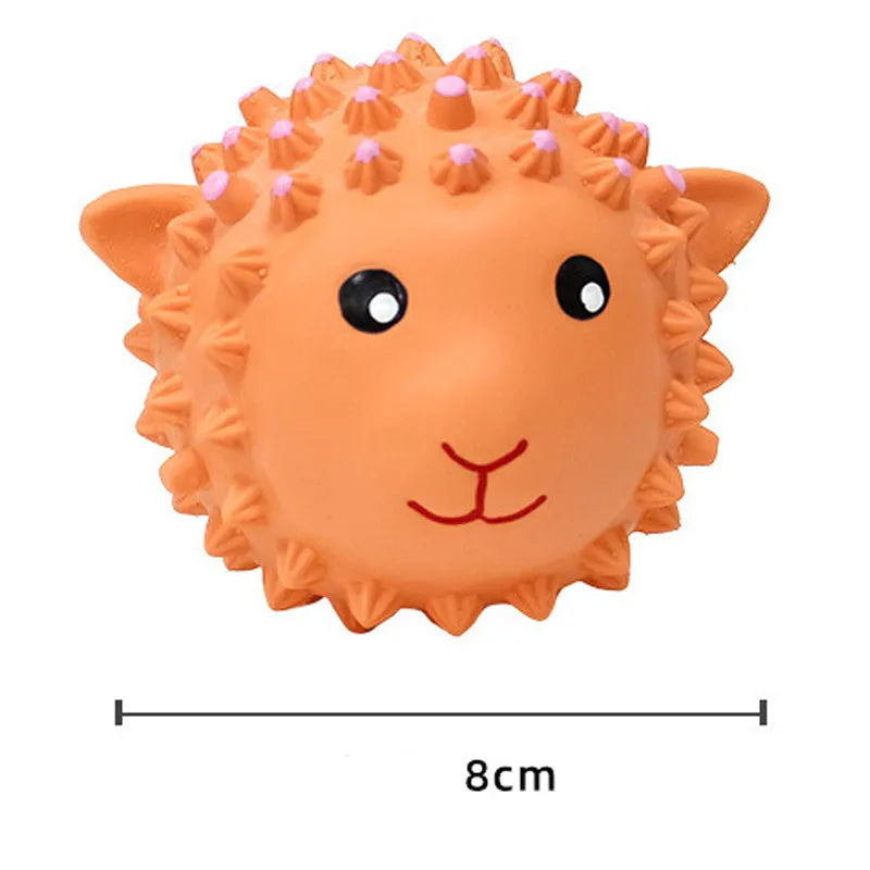 Orange and yellow spiky latex squeaky dog toy shaped like an animal, shown next to a tennis ball for size comparison.