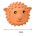 Orange and yellow spiky latex squeaky dog toy shaped like an animal, shown next to a tennis ball for size comparison.